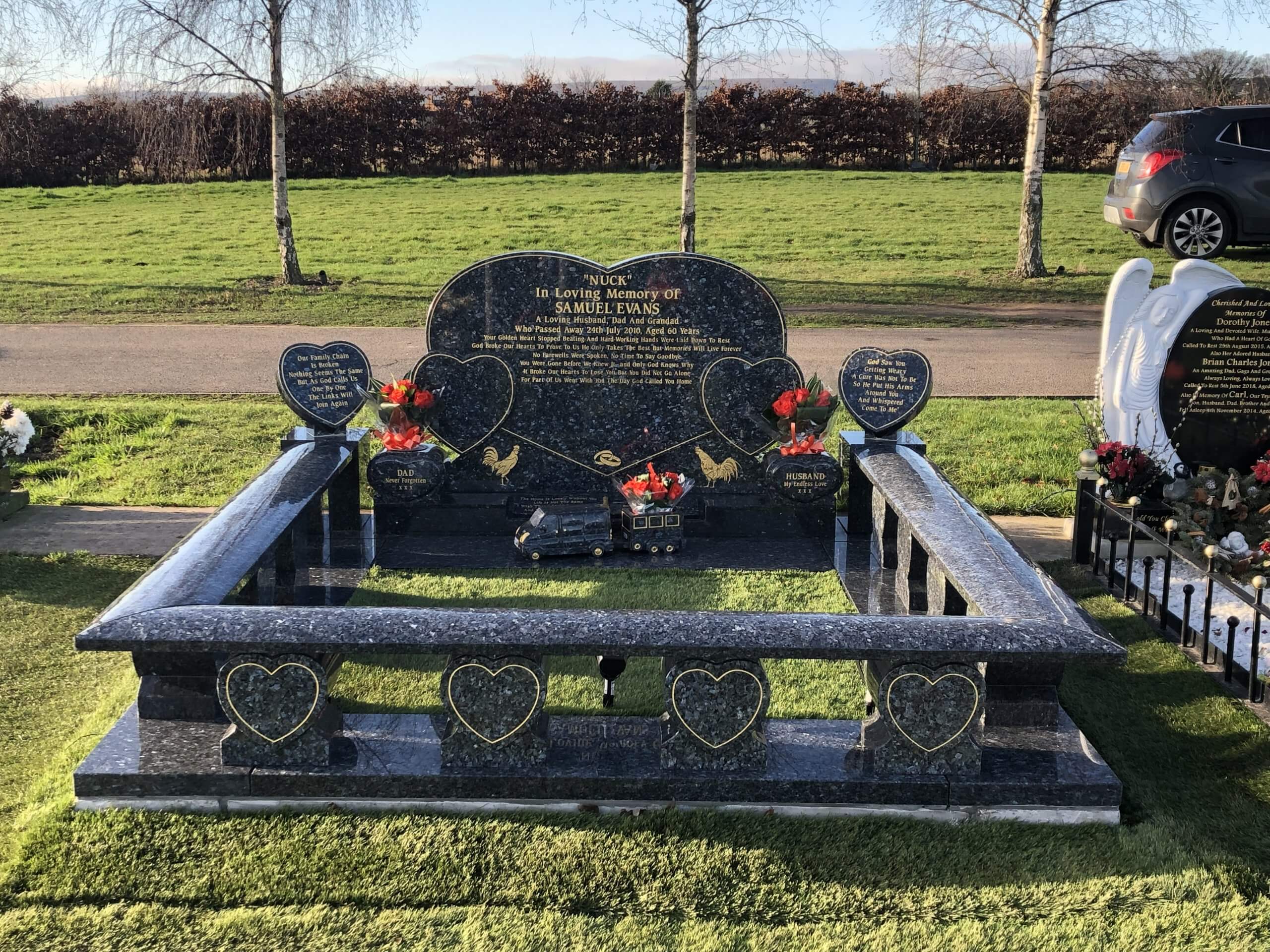 Grey granite kerbed memorial with heart details